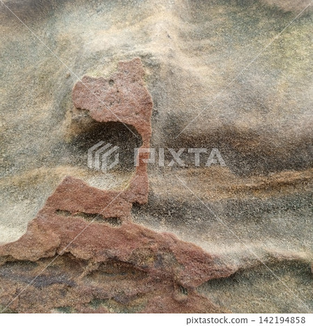 Heavily Weathered Sandstone Rock Texture Showing Natural Erosion Patterns And Distinct Geologic Layers In Outdoor Setting Heavily Weathered Sandstone Rock Texture Showing Natural Erosion Patterns And Distinct Geologic Layers In Outdoor Setting 142194858