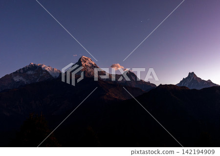 A view of the Annapurna South and Machhapuchhre mountain ranges at dawn from Poon Hill in Nepal. A view of the Annapurna South and Machhapuchhre mountain ranges at dawn from Poon Hill in Nepal. 142194909