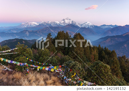 Sunrise over Dhaulagiri as seen from Poon Hill, Nepal. The Himalayan mountain landscape glows in the morning sun. Sunrise over Dhaulagiri as seen from Poon Hill, Nepal. The Himalayan mountain landscape glows in the morning sun. 142195132