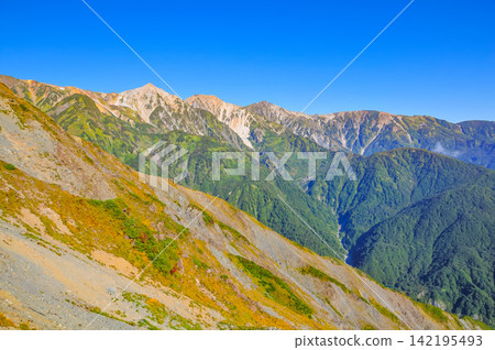 A clear autumn morning, a view of Hakuba Yarigatake, Shakushidake, and Hakubadake from the hiking trail of Karamatsudake. A clear autumn morning, a view of Hakuba Yarigatake, Shakushidake, and Hakubadake from the hiking trail of Karamatsudake. 142195493