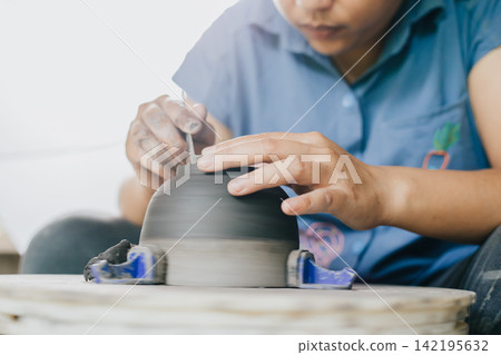 The process of creating pottery. The process of creating pottery. 142195632