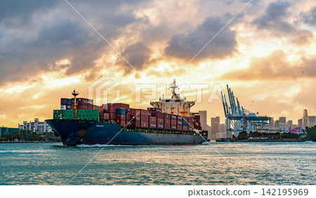 Miami, Florida, USA - December 16, 2024: Freight container on cargo vessel. Cargo ship vessel. Miami port on sunset. Container ship. Cargo Chloe D Monrovia ship with container, import Miami, Florida, USA - December 16, 2024: Freight container on cargo vessel. Cargo ship vessel. Miami port on sunset. Container ship. Cargo Chloe D Monrovia ship with container, import 142195969