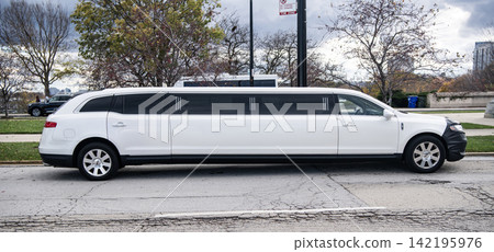 Chicago, USA - November 10, 2024: Lincoln MKT SUV limousine car parked outdoor. Limousine car of Lincoln MKT SUV. Limo or limousine Lincoln MKT. White Lincoln MKT SUV limousine, side view Chicago, USA - November 10, 2024: Lincoln MKT SUV limousine car parked outdoor. Limousine car of Lincoln MKT SUV. Limo or limousine Lincoln MKT. White Lincoln MKT SUV limousine, side view 142195976