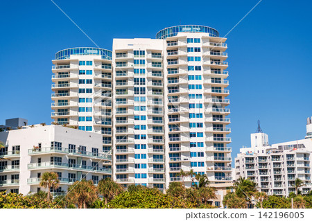Condominium architecture. Architecture of residential building. Residential house. Modern condominium building. Architectural building in neighborhood. Building perspective view. Urban lifestyle Condominium architecture. Architecture of residential building. Residential house. Modern condominium building. Architectural building in neighborhood. Building perspective view. Urban lifestyle 142196005