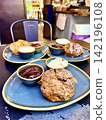Scones to eat at a restaurant 142196108