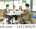 Four young Japanese men and women having a meeting in the office. Four young Japanese men and women having a meeting in the office. 142196829