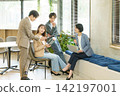 Four young Japanese men and women having a meeting in the office. Four young Japanese men and women having a meeting in the office. 142197001