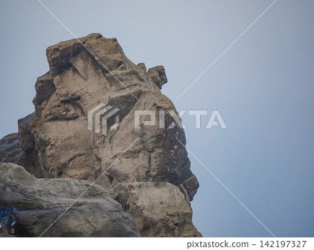 The iconic Sphinx rock formation at Klayar Beach (Pantai Klayar) in Pacitan, East Java, Indonesia. The iconic Sphinx rock formation at Klayar Beach (Pantai Klayar) in Pacitan, East Java, Indonesia. 142197327