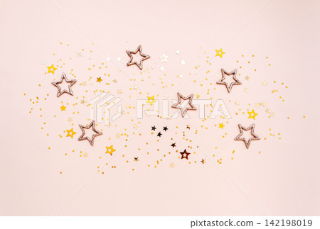 Golden Stars Festive Background on beige Golden Stars Festive Background on beige 142198019
