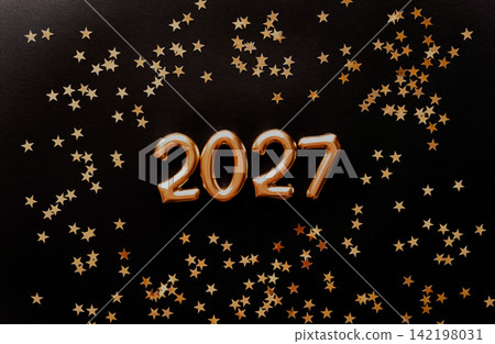 Golden 2027 Numbers with Star Confetti on Black Background Golden 2027 Numbers with Star Confetti on Black Background 142198031