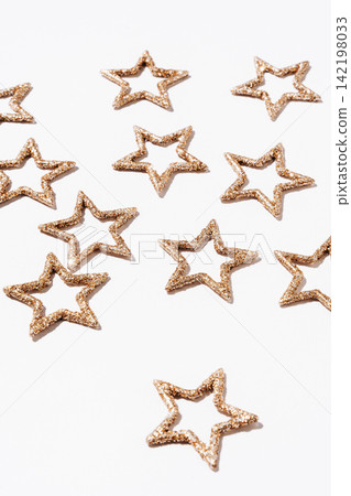 Golden Glitter Stars on White Background Golden Glitter Stars on White Background 142198033