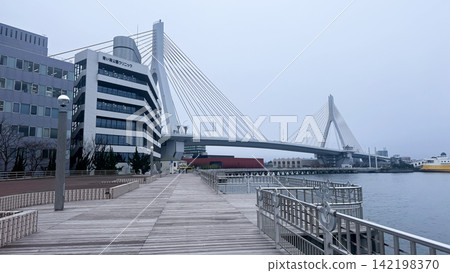 Aomori Bay Bridge spanning above a quiet waterfront promenade Aomori Bay Bridge spanning above a quiet waterfront promenade 142198370