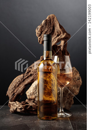 White wine with old snag and a piece of granite rock. White wine with old snag and a piece of granite rock. 142199003