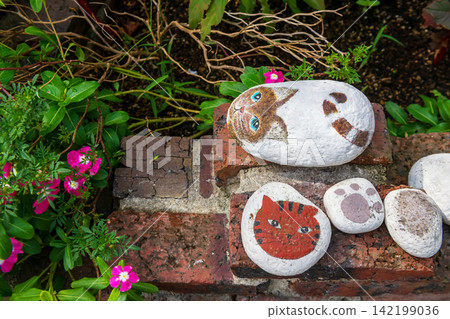 Top view of painted cat on rocks decor in Kamado Jigoku, Beppu 142199036