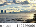 Gwangan bridge by modern skyscraper buildings at sunset, Busan 142199060