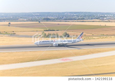 A plane landed at Charles de Gaulle Airport in Paris, France. A plane landed at Charles de Gaulle Airport in Paris, France. 142199118