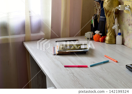 Desk surface and pencils. Desk surface and pencils. 142199324