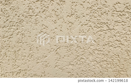 Close up of a light beige, off white textured stucco wall. Close up of a light beige, off white textured stucco wall. 142199618