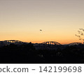 Arch bridge, sunset, airplane 142199698