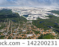 Aerial view of the white sand dunes and lagoon from the houses of Santo Amaro. 142200231