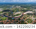 Aerial view of the Grande River flowing through a white sandbar and Santo Amaro. 142200234