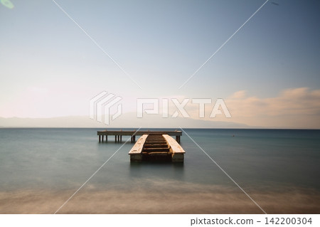 old, rusty abandoned and dismantled pier. sky space is empty. suitable for writing. old, rusty abandoned and dismantled pier. sky space is empty. suitable for writing. 142200304