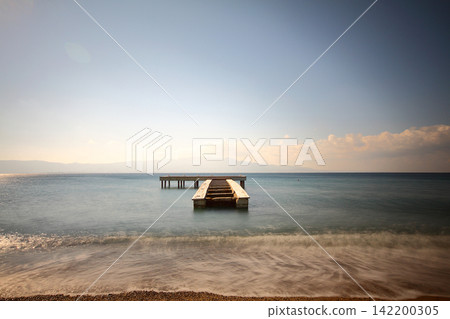 old, rusty abandoned and dismantled pier. sky space is empty. suitable for writing. old, rusty abandoned and dismantled pier. sky space is empty. suitable for writing. 142200305