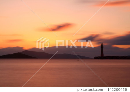 Seascape at sunshine. Lighthouse and sailings on the coast. Seaside town of Turgutreis and spectacular sunshine Seascape at sunshine. Lighthouse and sailings on the coast. Seaside town of Turgutreis and spectacular sunshine 142200456