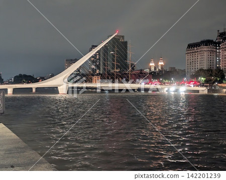 Buenos Aires, Argentina - October 27, 2025: Puente de la Mujer Illuminated at Night 142201239