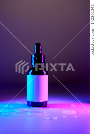 Skincare serum dropper bottle in neon light Skincare serum dropper bottle in neon light 142201348