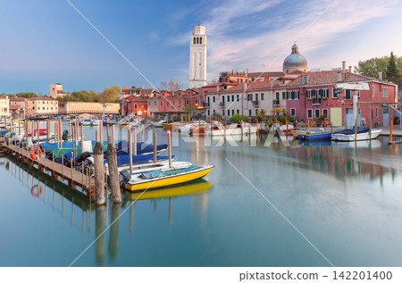 Castello Waterfront with Boats and Bell Tower at Dawn in Venice, Italy Castello Waterfront with Boats and Bell Tower at Dawn in Venice, Italy 142201400