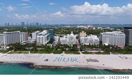 Aerial view of Miami skyline. Drone shot of Miami cityscape. Top view of South Miami and the ocean. Miami skyline with skyscrapers and coastline from above. Aerial view of Miami skyline. Drone shot of Miami cityscape. Top view of South Miami and the ocean. Miami skyline with skyscrapers and coastline from above. 142201449