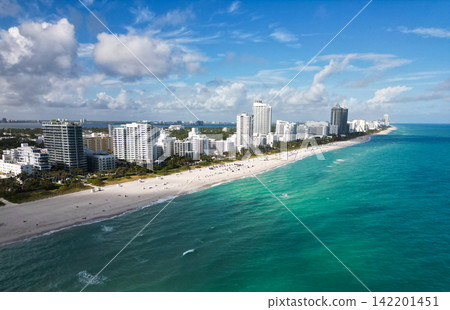 Miami cityscape with luxury skyscrapers and ocean. Panoramic view of Miami famous skyline. Miami Beach from above. Miami skyline from top. Miami cityscape with luxury skyscrapers and ocean. Panoramic view of Miami famous skyline. Miami Beach from above. Miami skyline from top. 142201451