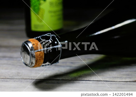 Sparkling wine with a close-up of the cork and wire. 142201494
