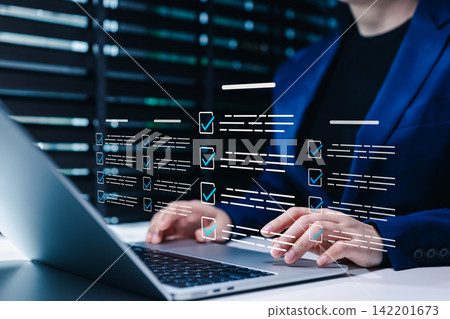 Online assessment and survey concept. Person using laptop with virtual checklist form, check mark, digital questionnaire, online test, exam, quiz, feedback response, data collection, task verification Online assessment and survey concept. Person using laptop with virtual checklist form, check mark, digital questionnaire, online test, exam, quiz, feedback response, data collection, task verification 142201673