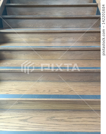 Wooden staircase with blue edge strips creating geometric pattern Wooden staircase with blue edge strips creating geometric pattern 142201684
