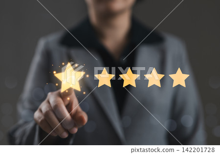 Five star rating and customer satisfaction review concept. Person touching star rating representing service quality evaluation, client feedback, positive experience, brand trust, reputation management Five star rating and customer satisfaction review concept. Person touching star rating representing service quality evaluation, client feedback, positive experience, brand trust, reputation management 142201728