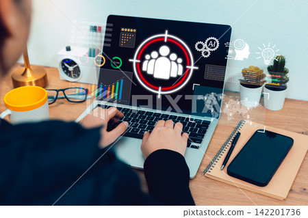 AI audience targeting concept. Person works on laptop with customer icon, charts, data dashboard, and analytics interface for digital marketing, segmentation, business insight, and campaign strategy AI audience targeting concept. Person works on laptop with customer icon, charts, data dashboard, and analytics interface for digital marketing, segmentation, business insight, and campaign strategy 142201736