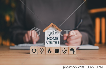 Home utilities budgeting concept with mini house and service icons for internet, electricity, gas, water, and waste. Perfect for financial planning, cost management, and household expense tracking. 142201761
