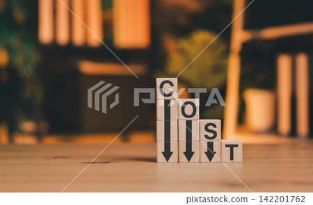 Concept of cost reduction and business savings. Wooden blocks spelling COST and downward arrows. Ideal for financial planning, expense management, and budget efficiency strategies. Business effective, Concept of cost reduction and business savings. Wooden blocks spelling COST and downward arrows. Ideal for financial planning, expense management, and budget efficiency strategies. Business effective, 142201762