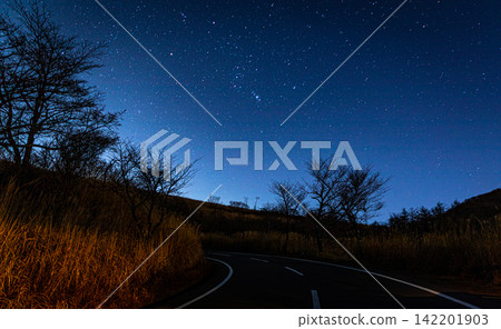 Winding Mountain Road Under a Brilliant Starry Sky in Japan Winding Mountain Road Under a Brilliant Starry Sky in Japan 142201903