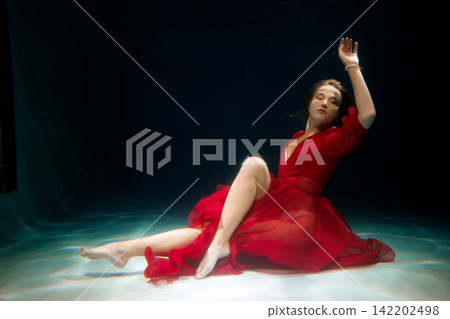 Cinematic image of woman in water with emotional intensity Cinematic image of woman in water with emotional intensity 142202498