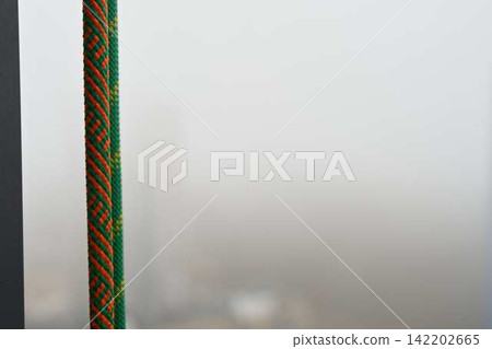 Promotional view highlighting security gear against urban mist setting Promotional view highlighting security gear against urban mist setting 142202665