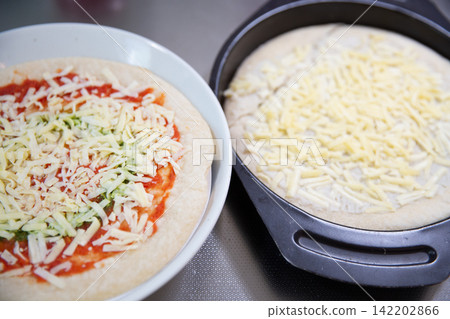 Frozen pizza before cooking Frozen pizza before cooking 142202866