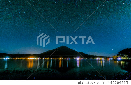 Mount Fuji and Lakeside Lights Beneath a Dense Milky Way Sky Mount Fuji and Lakeside Lights Beneath a Dense Milky Way Sky 142204365