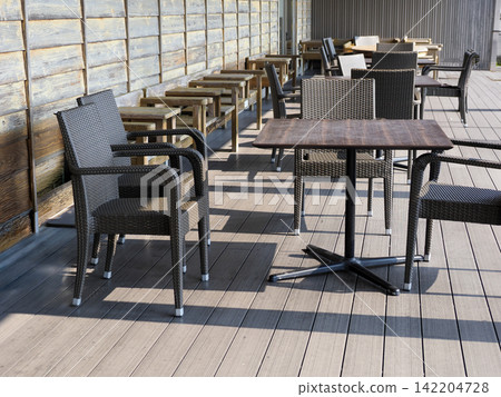 Tables and chairs on the terrace Tables and chairs on the terrace 142204728