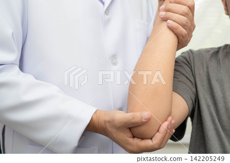 Physical therapy, Asian therapist doctor treat perform pain young man in hospital. 142205249