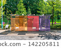 Colorful transparent glass public restroom with security sign at Yoyogi Fukamachi Mini Park Tokyo 142205811