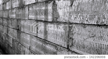 Rough texture of a black and white concrete block wall Rough texture of a black and white concrete block wall 142206008