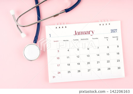 Blank January 2027 desk calendar and stethoscope, Medical appointment schedule to check up. Blank January 2027 desk calendar and stethoscope, Medical appointment schedule to check up. 142206163